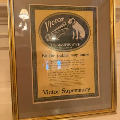 Framed vintage Victor Talking Machine Company advertisement, featuring the iconic 'His Master's Voice' Nipper dog...