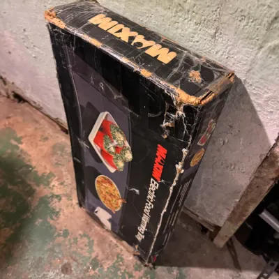 Vintage Maxim electric food warming tray in its original box, showing heavy wear and tape on the packaging.