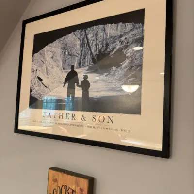 Framed inspirational art print titled 'Father & Son' featuring a black-and-white silhouette photograph and biblical quote,...