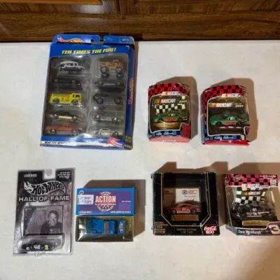 Sale Photo Thumbnail #82: Collection of packaged die-cast toy cars, including a Hot Wheels 10-pack set, NASCAR 2001 collectibles, and a Hot Wheels Hall of Fame carded car.