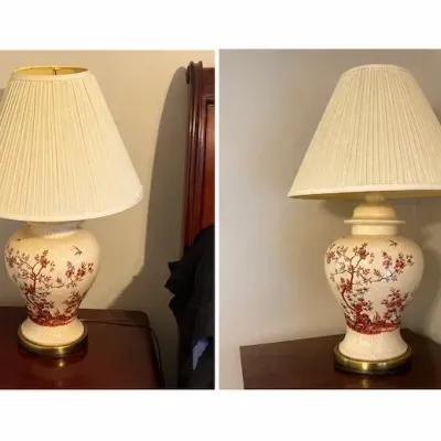 Sale Photo Thumbnail #164: Pair of Chinoiserie-style crackle glaze ceramic table lamps featuring red floral and bird motifs with pleated cream fabric shades.