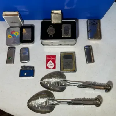 Sale Photo Thumbnail #57: Collection of vintage pocket lighters, Zippo tins, and a pair of adjustable metal shoe trees.