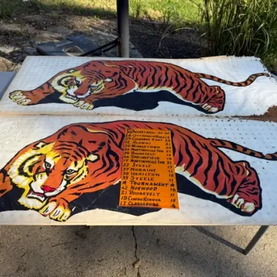 Sale Photo Thumbnail #488: Pair of vintage hand-painted tiger mascot pegboard signs, including one featuring a 1924-25 basketball game schedule and scores.