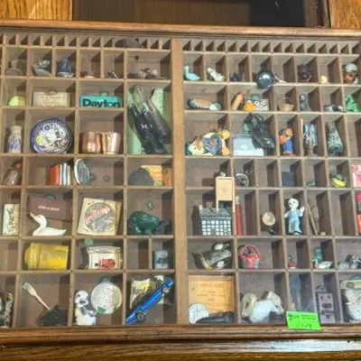 Sale Photo Thumbnail #265: Vintage glass-topped shadow box shadowcase filled with various miniature trinkets and collectibles.