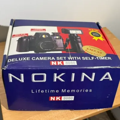 Sale Photo Thumbnail #390: Vintage Nokina NK 8080 Deluxe Camera Set with self-timer, in its original retail packaging.