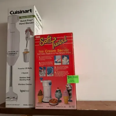 Sale Photo Thumbnail #274: Boxed Cuisinart Quick Prep hand blender alongside a vintage 1987 GS Soft Twirl ice cream server in its original packaging.
