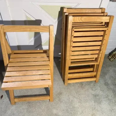 Sale Photo Thumbnail #197: Set of natural wood slatted folding chairs, shown both open and stacked.