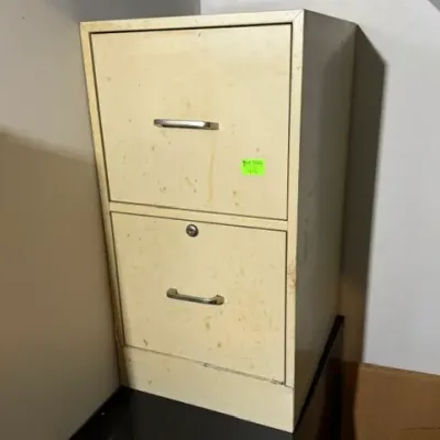Sale Photo Thumbnail #404: Vintage two-drawer metal filing cabinet in cream finish, showing light wear and surface staining.