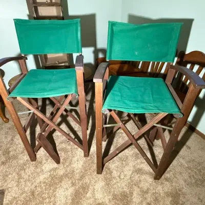 Sale Photo Thumbnail #328: Pair of tall wooden director's chairs with green canvas seats and backrests.