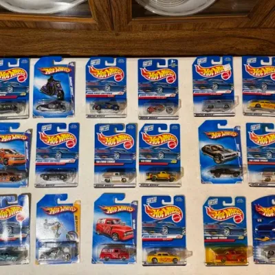 Sale Photo Thumbnail #87: Collection of 18 packaged Hot Wheels die-cast toy vehicles, predominantly from late 1990s and 2000s First Editions series.