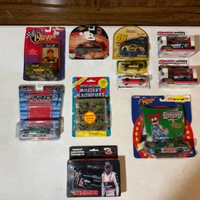 Sale Photo Thumbnail #97: Collection of packaged die-cast toy cars and miniature military vehicles, including NASCAR Winner's Circle, Action, and Pro Rodz models.