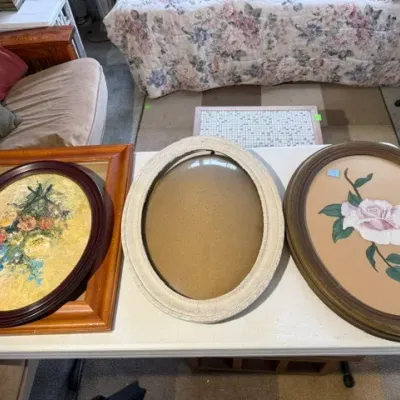 Sale Photo Thumbnail #192: Collection of vintage oval picture frames and floral artwork, including a framed oil painting with floral bouquet and a painted pink rose print.