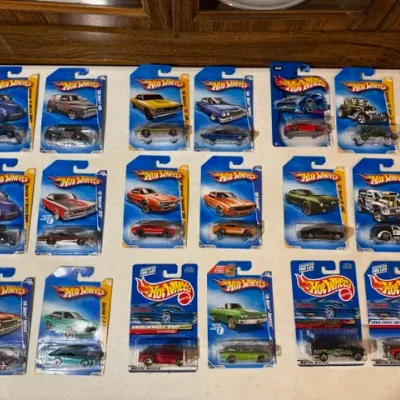 Sale Photo Thumbnail #90: Collection of 18 vintage Mattel Hot Wheels die-cast toy cars, sealed on original blister cards.