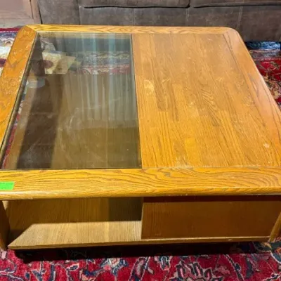 Sale Photo Thumbnail #253: Vintage light oak square coffee table featuring a glass insert top, open storage, and rounded edges.