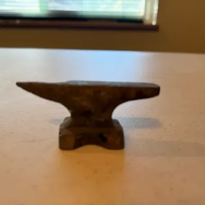 Sale Photo Thumbnail #33: Small vintage cast iron miniature anvil novelty paperweight.