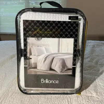 Sale Photo Thumbnail #156: Michael Amini "Brilliance" king-size bedding set in original zippered clear vinyl storage case.