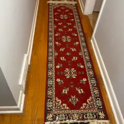 Sale Photo Thumbnail #142: Traditional red oriental-style hallway runner rug with intricate floral motifs and fringe ends.