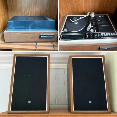 Sale Photo Thumbnail #180: Vintage Realistic solid-state stereo turntable system with integrated cassette deck, dust cover, and a matching pair of wood grain cabinet speakers.