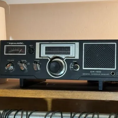 Sale Photo Thumbnail #331: Vintage Realistic DX-100 general coverage shortwave radio receiver, featuring an analog S-meter and built-in speaker.