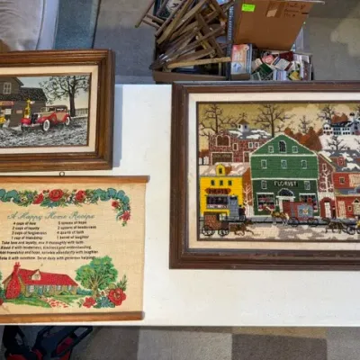 Sale Photo Thumbnail #217: Collection of vintage framed needlepoint art and a fabric scroll wall hanging featuring nostalgic rural and town scenes.