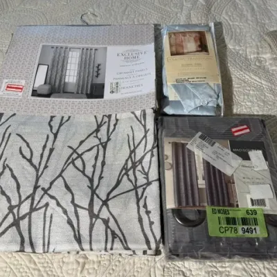 Sale Photo Thumbnail #154: Assortment of packaged window curtain panels, including brands Exclusive Home, Classic Traditions, and Madison Park.