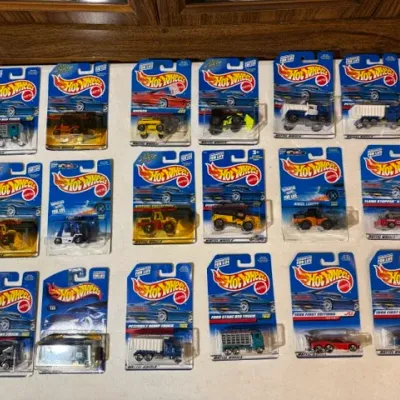Sale Photo Thumbnail #91: Collection of 18 vintage Mattel Hot Wheels die-cast vehicles, unopened in their original blister pack packaging from the late 1990s.