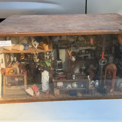 Sale Photo Thumbnail #461: Vintage handmade shadow box diorama depicting an intricate general store scene housed in a wooden display case.