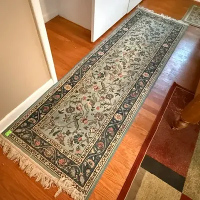 Sale Photo Thumbnail #149: Traditional Persian-style floral runner rug in sage green, navy, and cream tones featuring fringed ends.
