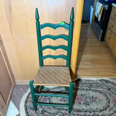 Sale Photo Thumbnail #259: Vintage green painted ladderback side chair featuring a woven rush seat and tall pointed finials.