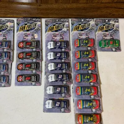 Sale Photo Thumbnail #81: Collection of vintage Action Fan Fueler 1:64 scale die-cast NASCAR stock cars, sealed in original blister card packaging.