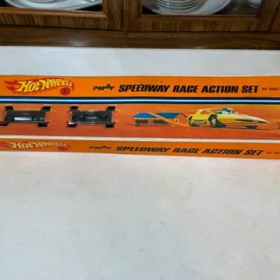 Sale Photo Thumbnail #72: Vintage Hot Wheels Pop-Up Speedway Race Action Set by Mattel in its original orange display box.