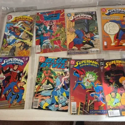 Sale Photo Thumbnail #431: Collection of bagged and boarded modern-era comic books, including issues of Superman Adventures, Blue Devil, and Impact Comics The Web.