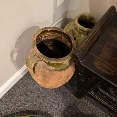 Sale Photo Thumbnail #26: Pair of vintage rustic terracotta urns with weathered green glazed trim and side handles.