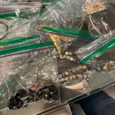 Sale Photo Thumbnail #12: Collection of vintage fashion jewelry individual packaged in clear plastic ziplock bags, including beaded necklaces, bracelets, and pendants.