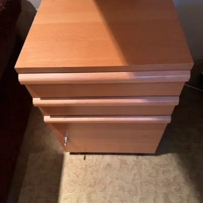 Sale Photo Thumbnail #68: Modern natural wood rolling pedestal cabinet featuring two upper drawers and a lower locking file drawer.