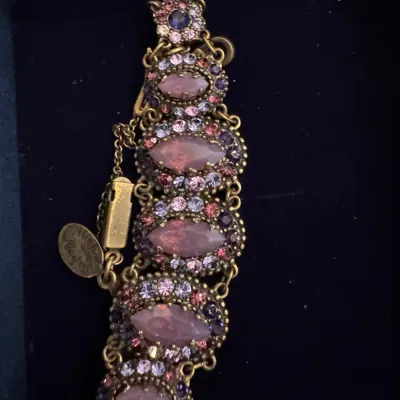 Sale Photo Thumbnail #14: Michal Negrin vintage style brass link bracelet featuring pink marquise-cut stones surrounded by multicolored Swarovski crystals.