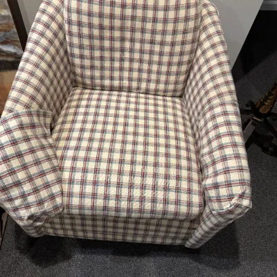 Sale Photo Thumbnail #54: Vintage upholstered armchair with a red, blue, and cream plaid fabric pattern and matching arm covers.