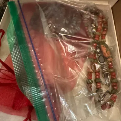 Sale Photo Thumbnail #15: Selection of beaded necklaces packaged in plastic ziplock bags inside a gift box.