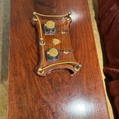 Sale Photo Thumbnail #69: Antique wooden desktop inkstand featuring brass railings, dual glass inkwells with brass lids, and pen rests, resting on a polished wood table.