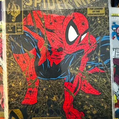 Sale Photo Thumbnail #4: Spider-Man #1 gold polybagged variant edition by Todd McFarlane, August 1990, housed in a protective plastic sleeve.