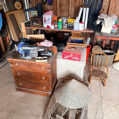 Assorted workshop and household items including a vintage wooden three-drawer dresser, a child's wooden rocking chair, metal wire...