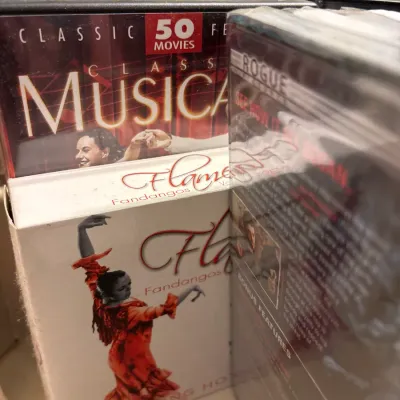 Collection of DVD box sets, including a 50 Classic Movies Musicals set and a Flamenco Fandangos performance video.