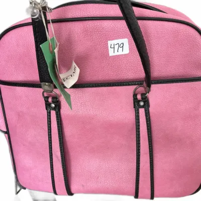 Vintage bright pink pebbled leather shoulder bag with black piping accents and dual black handles.