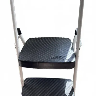 Cosco two-step folding stool featuring a white metal frame and black grooved plastic treads.