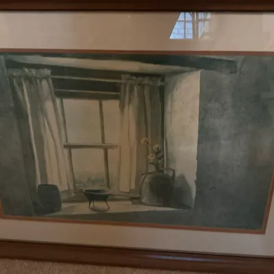 Framed watercolor print depicting a quiet interior window scene with curtains and pottery, presented in a wooden frame with a double mat.