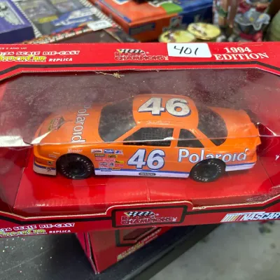 Racing Champions 1:24 scale die-cast stock car replica, 1994 edition featuring the #46 Polaroid car, new in original box.