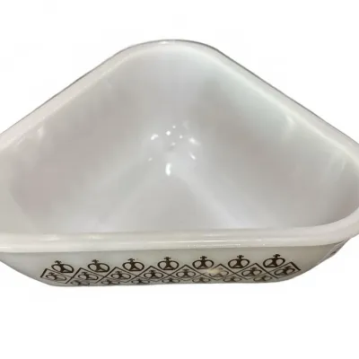 Vintage white milk glass triangular serving bowl with a black geometric crown pattern along the exterior edge.