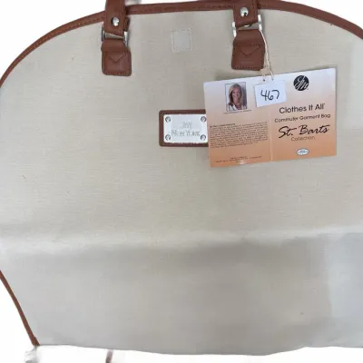 JM New York 'Clothes It All' commuter garment bag from the St. Barts Collection, featuring beige canvas with brown trim and...