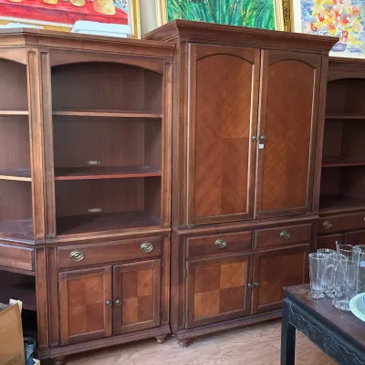 Large multi-piece wooden entertainment wall unit featuring open shelving, lower cabinet storage, and parquet wood panel details.