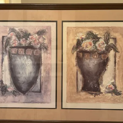 Framed pair of mixed media abstract floral still life prints in a wooden frame with double matting.